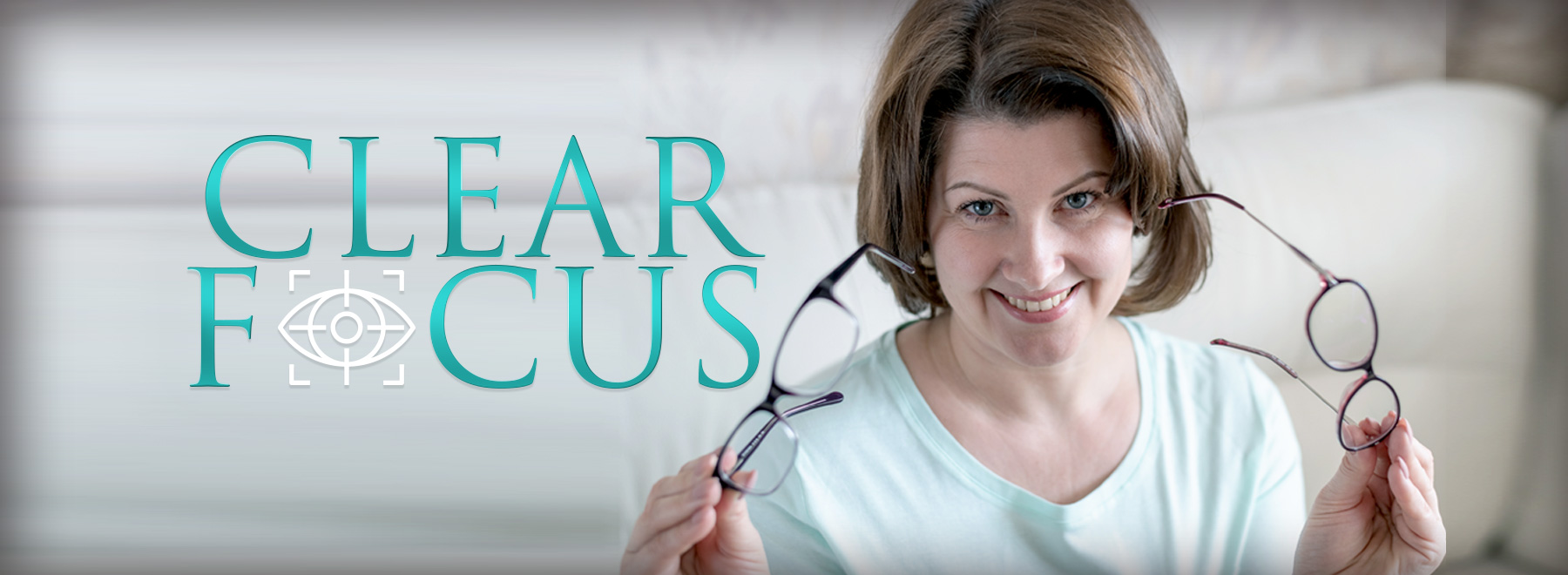 Clear Focus woman with reading glasses in hand
